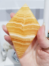 Load image into Gallery viewer, Diamond Orange Calcite Crystal Carving on Silver Stand Stone 180mm 1 LARGE & STUNNING!