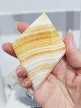 Load image into Gallery viewer, Diamond Orange Calcite Crystal Carving on Silver Stand Stone 165mm 4 BEAUTIFUL BANDING