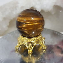 Load image into Gallery viewer, Tigers Eye Sphere Crystal Carving on Gold Stand Stone 30mm 1