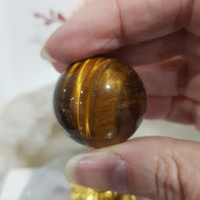 Load image into Gallery viewer, Tigers Eye Sphere Crystal Carving on Gold Stand Stone 30mm 1