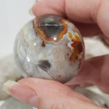 Load image into Gallery viewer, Mexican Agate Sphere Crystal Carving on Silver Stand Stone 45mm 1