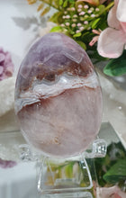 Load image into Gallery viewer, Amethyst Agate Egg Crystal Carving Stone on Stand
Inspires intuition and Emotional Well Being
Beautiful Polished Amethyst Agate Egg Crystal Carving on plastic stand. Has natural divits formations.