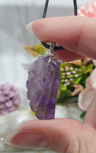 Load image into Gallery viewer, "WING OF AN ANGEL" Amethyst Angel Wing Crystal Stone Pendant wire wrapped Silver .
Inspires Divine Connection and Intuition.
Angel Wings symbolise love, protection, purity and freedom. Connections to the Angels and divine realm.
Beautiful handcrafted Amethyst Angel Wing Crystal Carving Pendant in silver non tarnish wire. Comes with a cord necklace.