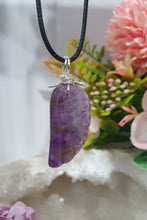 Load image into Gallery viewer, "WING OF AN ANGEL" Amethyst Angel Wing Crystal Stone Pendant wire wrapped Silver .
Inspires Divine Connection and Intuition.
Angel Wings symbolise love, protection, purity and freedom. Connections to the Angels and divine realm.
Beautiful handcrafted Amethyst Angel Wing Crystal Carving Pendant in silver non tarnish wire. Comes with a cord necklace.