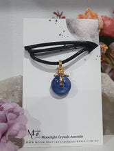 Load image into Gallery viewer, Stunning Blue Kyanite crystal stone donut crystal carving wire wrapped in non tarnish gold wire. Come with a black cork necklace.