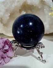 Load image into Gallery viewer, Sparkly Blue Sandstone Sphere Crystal Carving on Silver Stand. Inspires Concentration and Courage. Gorgeous