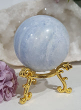 Load image into Gallery viewer, Celestite Sphere Crystal Carving on Gold Stand. Inspires Communication with the Angels