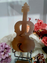 Load image into Gallery viewer, Beautiful Guitar Agate Crystal Carving Stone on Silver Stand. Promotes balance and harmony. Great gift for any music lover