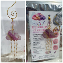 Load image into Gallery viewer, Lovely "EVERY CLOUD HAS A SILVER LINING" Fluorite Cloud gold wired Crystal Energy Enhancer© Hanger Ornament Suncatcher.
From Darkness comes Light.
TRANSFORMATION / INTUITION / SPIRITUALITY
Beautiful Fluorite Cloud Crystal Carving beaded with Fluorite & Quartz. wired in Gold