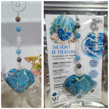 Load image into Gallery viewer, HEART OF THE OCEAN" Handcrafted Titanium Aura Sphalerite Heart Crystal Carving Silver Crystal Energy Enhancer© / Hanger / Ornament / Suncatcher
Inspires PSYCHIC FLOW | LOVE | INTUITION
Gorgeous Titanium Aura Sphalerite heart crystal carving stone beaded with Aquamarine, Rainbow Hematite & Quartz. Wire wrapped in silver