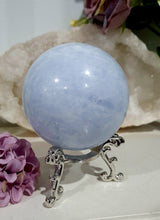 Load image into Gallery viewer, Celestite Sphere Crystal Carving on Silver Stand. Inspires Communication with the Angels