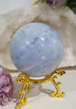Load image into Gallery viewer, Celestite Sphere Crystal Carving on Gold Stand. Inspires Communication with the Angels