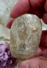 Load image into Gallery viewer, Lovely Moonstone Palm Stone Crystal Carving on plastic stand. Inspires Divine Connection and Clarity