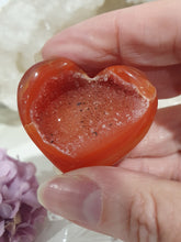 Load image into Gallery viewer, Stunning Carnelian Heart Crystal Carving on Stand. Inspires Sensuality and Self Confidence. Fantastic Druzy