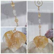 Load image into Gallery viewer, This stunning Ultimate Healer Crystal Energy Enhancer Suncatcher is handcrafted and created with a stunning Golden Healer heart and beaded with golden healer and quartz. Hang in your home or space and feel the ambient energy. Inspires Power and connection.