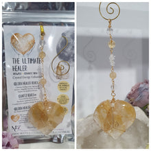 Load image into Gallery viewer, This stunning Ultimate Healer Crystal Energy Enhancer Suncatcher is handcrafted and created with a stunning Golden Healer heart and beaded with golden healer and quartz. Hang in your home or space and feel the ambient energy. Inspires Power and connection.