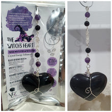 Load image into Gallery viewer, THE WITCHES HEART" Handcrafted Obsidian Heart Crystal Carving Stone Silver Crystal Energy Enhancer© Hanger Ornament Suncatcher
INSPIRES MAGIC, INTUITION AND PROTECTION
Gorgeous Obsidian heart crystal carving stone beaded with Black Obsidian, Amethyst and Herkimer Diamonds. Wire wrapped in silver