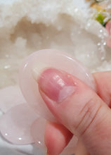 Load image into Gallery viewer, "Worry Stone" Rose Quartz Crystal Carving Stone.
INSPIRES UNCONDITIONAL LOVE & HARMONY
What is a worry Stone? Perfectly shaped for your thumb, this crystal worry stone connects you to positive energy. Rubbing its smooth surface allows it to act as a powerful vessel for emotional release from anxiety and stress.
Lovely Rose Quartz crystal worry stone crystal carving. Pop in your bag and keep with you to alleviate stress. Intuitively ( Randomly) chosen.