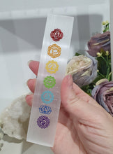 Load image into Gallery viewer, Selenite Cleansing Crystal Slab with Rainbow Chakra Symbols Stone. Inspires Connection to the Angelic Realms
Beautiful Selenite Slab with Embossed Chakra Symbols.. Perfect to cleanse your space and crystals