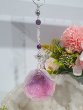 Load image into Gallery viewer, MAGICAL CRYSTAL CAVE - Handcrafted Titanium Aura Quartz Geode Crystal Energy Enhancer© / Hanger / Ornament / Suncatchers
DIVINE COMMUNICATION | HARMONY | MAGICK
Gorgeous Titanium Aura Quartz Geode crystal beaded with Rose Quartz, Amethyst and Rainbow Hematite. Wire wrapped in silver
Genuine Crystals. no plastic or glass. Ensuring energy flow throughout the enhancer.