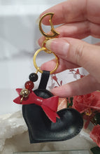 Load image into Gallery viewer, Love & Seductions Crystal Keyring on gold. Vinyl Heart with bow. Beaded with Obsidian, Carnelian and pyrite. Protection, Love and Seduction.