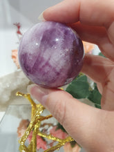 Load image into Gallery viewer, Purple Fluorite Sphere Crystal Carving Stone on Gold Branch shaped stand.