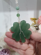 Load image into Gallery viewer, LUCKY FOUR-LEAF CLOVER BLESSINGS" Handcrafted Aventurine Crystal Carving Silver Stone Crystal Energy Enhancer© / Hanger / Ornament / Suncatcher
Promotes GOOD FORTUNE | HOPE | MAGIC | PROTECTION
A four-leaf clover Symbolises good luck and abundance. It is believed if you hold a four-leaf clover you will gain the ability to see fairies and leprechauns and find their treasures.
Beautiful Aventurine four-leaf clover crystal carving beaded with Amazonite, Aventurine and Quartz. Wire wrapped in Silver.