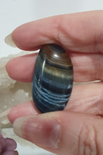 Load image into Gallery viewer, Blue Tigers Eye Crystal Tumble Stone
Inspires Courage
Gorgeous Blue Tigers Eye Crystal Tumble Stone. Absolutely stunning shine