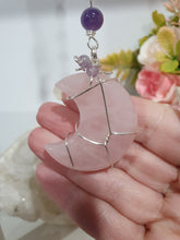 Load image into Gallery viewer, THE PINK MOON" Handcrafted Rose Quartz Moon Carving Stone Silver Crystal Energy Enhancer© Hanger Ornament Suncatcher
INSPIRES LOVE | HARMONY | GROWTH
Beautiful Rose Quartz Moon Crystal Carving beaded with Rose Quartz and Amethyst. wired in silver