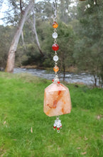 Load image into Gallery viewer, THE FIRE WITHIN" Handcrafted Fire Quartz Tower Crystal Carving Silver Crystal Energy Enhancer© Gemstone / Hanger / Suncatcher / Ornament
STRENGTH | POWER | SPIRITUALITY
Beautiful Fire Quartz Tower Carving Crystal Energy Enhancer© / Sun Catcher / Ornament / Hanger beaded with Fire Quartz, Carnelian and Quartz. wired in Silver