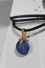 Load image into Gallery viewer, Stunning Blue Kyanite crystal stone donut crystal carving wire wrapped in non tarnish gold wire. Come with a black cork necklace.
