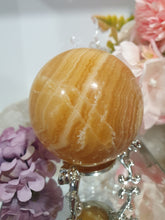 Load image into Gallery viewer, Orange Calcite Sphere Crystal Carving Stone on Silver Stand. This has a crack in it
Inspires JOY AND SELF CONFIDENCE
Lovely Orange Calcite Crystal Sphere on silver stand. Discounted as has a crack. still a gorgeous sphere.