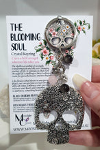 Load image into Gallery viewer, THE BLOOMING SOUL " Metal Skull Keyring Key chain with Rose Quartz & Black Obsidian Beads Stone Silver Crystal Key Ring
INSPIRES STRENGTH AND TRANSFORMATION
Carry a little Strength wherever life takes you!