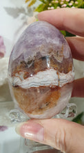 Load image into Gallery viewer, Amethyst Agate Egg Crystal Carving Stone on Stand
Inspires intuition and Emotional Well Being
Beautiful Polished Amethyst Agate Egg Crystal Carving on plastic stand. Has natural divits formations.