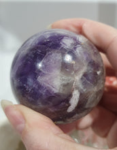 Load image into Gallery viewer, Amethyst Chevron Sphere Crystal Carving Stone on Gold Stand
Inspires INTUITION AND SPIRITUALITY
Lovely Amethyst Crystal Sphere on gold stand. Gorgeous colouring.