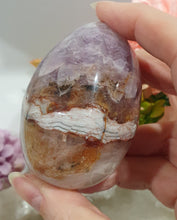 Load image into Gallery viewer, Amethyst Agate Egg Crystal Carving Stone on Stand
Inspires intuition and Emotional Well Being
Beautiful Polished Amethyst Agate Egg Crystal Carving on plastic stand. Has natural divits formations.
