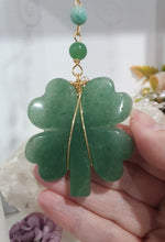 Load image into Gallery viewer, LUCKY FOUR-LEAF CLOVER BLESSINGS" Handcrafted Aventurine Crystal Carving Gold Stone Crystal Energy Enhancer© / Hanger / Ornament / Suncatcher
Promotes GOOD FORTUNE | HOPE | MAGIC | PROTECTION
A four-leaf clover Symbolises good luck and abundance. It is believed if you hold a four-leaf clover you will gain the ability to see fairies and leprechauns and find their treasures.
Beautiful Aventurine four-leaf clover crystal carving beaded with Amazonite, Aventurine and Quartz. Wire wrapped in Gold.