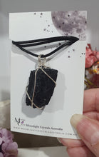 Load image into Gallery viewer, Gorgeous Black Tourmaline crystal stone wire wrapped in silver with black cord. Black Tourmaline promotes protective energy.