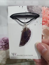 Load image into Gallery viewer, "WING OF AN ANGEL" Amethyst Angel Wing Crystal Stone Pendant wire wrapped Silver .
Inspires Divine Connection and Intuition.
Angel Wings symbolise love, protection, purity and freedom. Connections to the Angels and divine realm.
Beautiful handcrafted Amethyst Angel Wing Crystal Carving Pendant in silver non tarnish wire. Comes with a cord necklace.