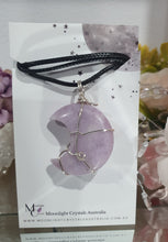 Load image into Gallery viewer, Lepidolite Moon Crystal Pendant Wire Wrapped Silver Stone with black cord chain
STONE OF TRANSITION
Beautiful Lepidolite Moon Crystal Carving Wire Wrapper in Silver non tarnish wire. Accompanied by a black cord necklace