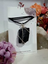 Load image into Gallery viewer, Gorgeous Black Tourmaline crystal stone wire wrapped in silver with black cord. Black Tourmaline promotes protective energy.