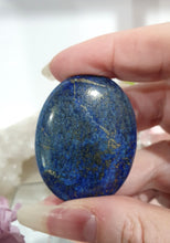Load image into Gallery viewer, Lapis Lazuli Crystal Palm Stone palm stone on plastic stand.
INSPIRES HARMONY, WISDOM & PSYCHIC PROTECTION
Lovely Lapis Lazuli Crystal Palm stone with pyrite inclusions on plastic stand. So pretty.
