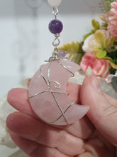 Load image into Gallery viewer, THE PINK MOON" Handcrafted Rose Quartz Moon Carving Stone Silver Crystal Energy Enhancer© Hanger Ornament Suncatcher
INSPIRES LOVE | HARMONY | GROWTH
Beautiful Rose Quartz Moon Crystal Carving beaded with Rose Quartz and Amethyst. wired in silver