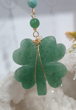 Load image into Gallery viewer, LUCKY FOUR-LEAF CLOVER BLESSINGS" Handcrafted Aventurine Crystal Carving Gold Stone Crystal Energy Enhancer© / Hanger / Ornament / Suncatcher
Promotes GOOD FORTUNE | HOPE | MAGIC | PROTECTION
A four-leaf clover Symbolises good luck and abundance. It is believed if you hold a four-leaf clover you will gain the ability to see fairies and leprechauns and find their treasures.
Beautiful Aventurine four-leaf clover crystal carving beaded with Amazonite, Aventurine and Quartz. Wire wrapped in Gold.