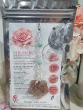 Load image into Gallery viewer, "THE BLUSHING ROSE" Strawberry Quartz Rose Carving silver Crystal Energy Enhancer© Hanger Ornament Suncatcher.
HAPPINESS / LOVE / HARMONY
"THE BLUSHING ROSE - Like the petals of a rose unfolding, The Blushing Rose encourages us to embrace self-love, joy and the beauty within."
Gorgeous Strawberry Quartz Rose Crystal Carving beaded with Ice Pink Malaysian Jade, Rose Quartz, Amazonite and Quartz. Wire wrapped in silver