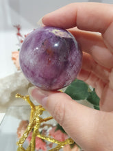 Load image into Gallery viewer, Purple Fluorite Sphere Crystal Carving Stone on Gold Branch shaped stand.