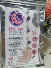 Load image into Gallery viewer, THE PINK MOON" Handcrafted Rose Quartz Moon Carving Stone Silver Crystal Energy Enhancer© Hanger Ornament Suncatcher
INSPIRES LOVE | HARMONY | GROWTH
Beautiful Rose Quartz Moon Crystal Carving beaded with Rose Quartz and Amethyst. wired in silver