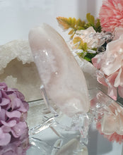 Load image into Gallery viewer, Pink Amethyst / Flower Agate Crystal Palm Stone palmstone on stand.
Inspires ENCOURAGEMENT & SELF DISCOVERY
Pink Amethyst / Flower Agate Crystal Palm stone on plastic stand. So lovely.