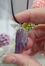 Load image into Gallery viewer, "WING OF AN ANGEL" Amethyst Angel Wing Crystal Stone Pendant wire wrapped Silver .
Inspires Divine Connection and Intuition.
Angel Wings symbolise love, protection, purity and freedom. Connections to the Angels and divine realm.
Beautiful handcrafted Amethyst Angel Wing Crystal Carving Pendant in silver non tarnish wire. Comes with a cord necklace.