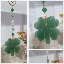 Load image into Gallery viewer, LUCKY FOUR-LEAF CLOVER BLESSINGS" Handcrafted Aventurine Crystal Carving Gold Stone Crystal Energy Enhancer© / Hanger / Ornament / Suncatcher
Promotes GOOD FORTUNE | HOPE | MAGIC | PROTECTION
A four-leaf clover Symbolises good luck and abundance. It is believed if you hold a four-leaf clover you will gain the ability to see fairies and leprechauns and find their treasures.
Beautiful Aventurine four-leaf clover crystal carving beaded with Amazonite, Aventurine and Quartz. Wire wrapped in Gold.
